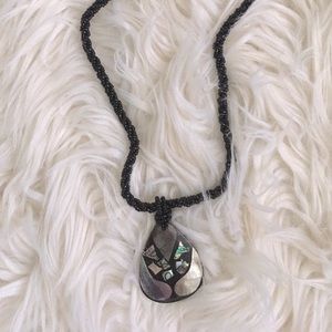 Black beaded and shell pendant necklace